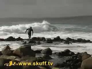 Dorko surfer gets nailed against rocks!