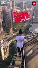 Chinese Daredevil challenged skyscraper elevator.