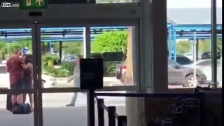 Drunk couple fight outside of the airport