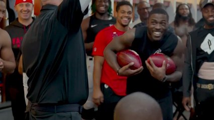 Dan Quinn gives Tevin Coleman two game balls in honor of his newborn twins