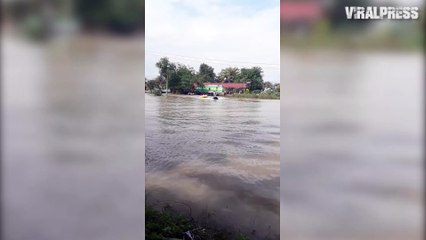 Father Uses Jet Ski To Pull Kids In Flood