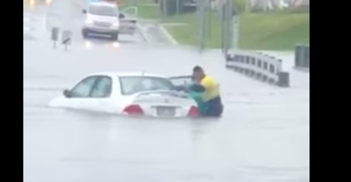 Woman Rescued From Car Swept Up in Floodwaters