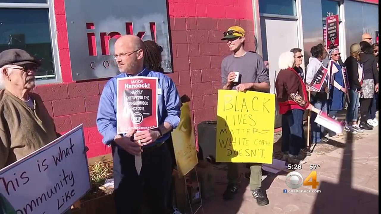 Protest held outside ‘ink! Coffee’ in Denver over a gentrification sign.