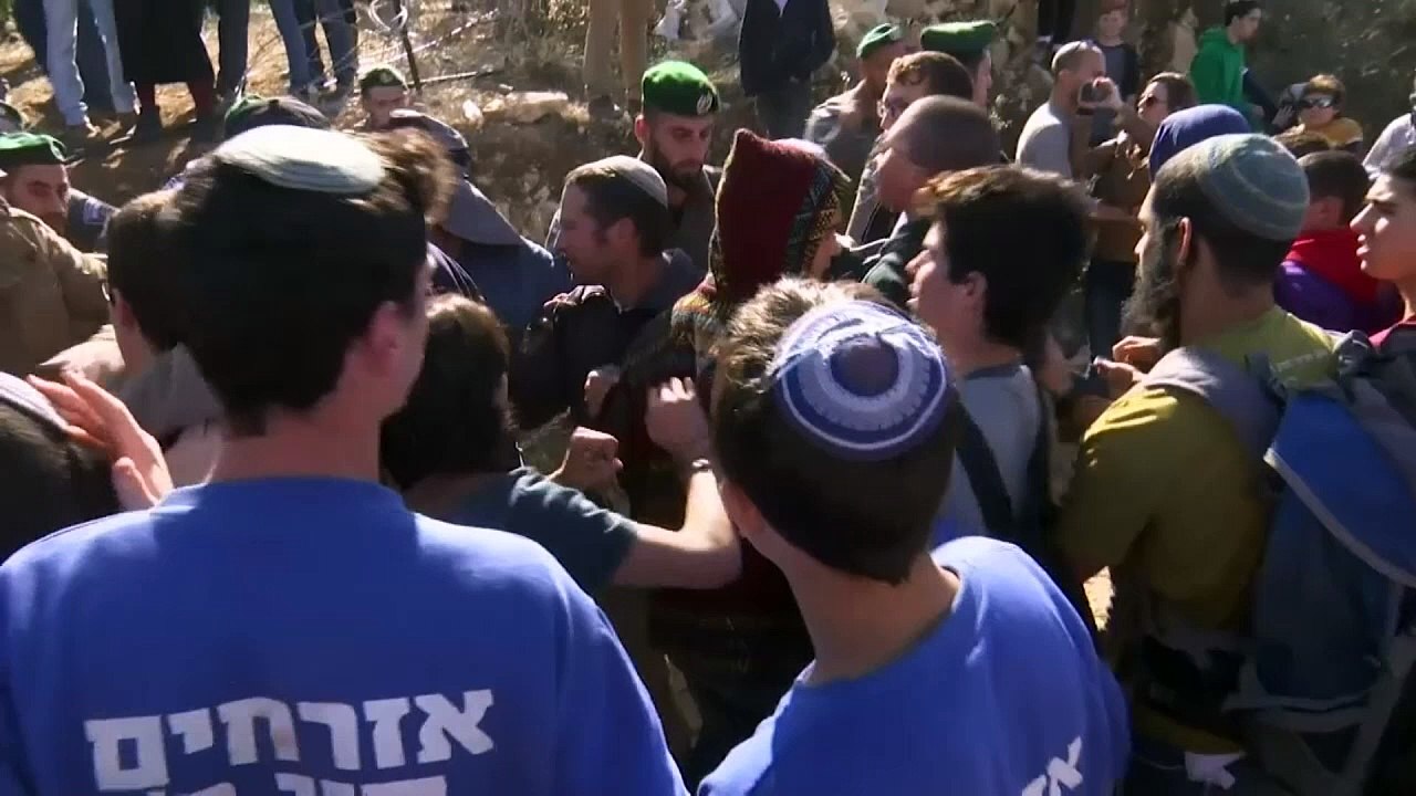 Protestors forcibly removed from West Bank demolition