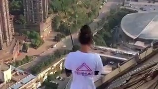 Chinese Daredevil challenged skyscraper elevator.
