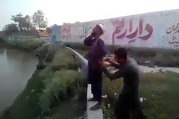 Funny water prank on a person busy on phone call