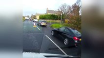 Driver nearly hits oncoming car on partially closed road