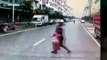 Woman crossing road narrowly escapes being run over by lorry