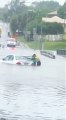 Woman Rescued From Car Swept Up in Floodwaters