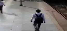 Man tries to catch a train, but train catches him
