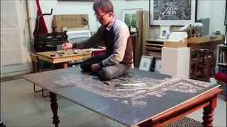 David Frazer makes lino cut of 'Slow Boat'.