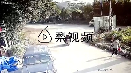 Two people on a motorcycle do not yield for oncoming traffic and gets hit by a dump truck