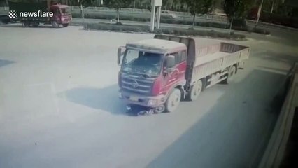 Scooter driver miraculously survives being dragged by lorry