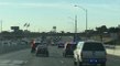 Guy Merges Onto The Highway Directly Into The Middle Of A Huge Police Chase