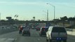 Guy Merges Onto The Highway Directly Into The Middle Of A Huge Police Chase