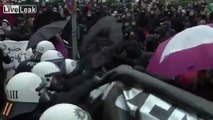 Riots and water cannons at protests in Germany. (happens right now)