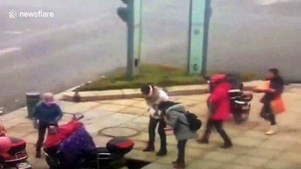Pedestrian swallowed by sink hole when it opens on city street