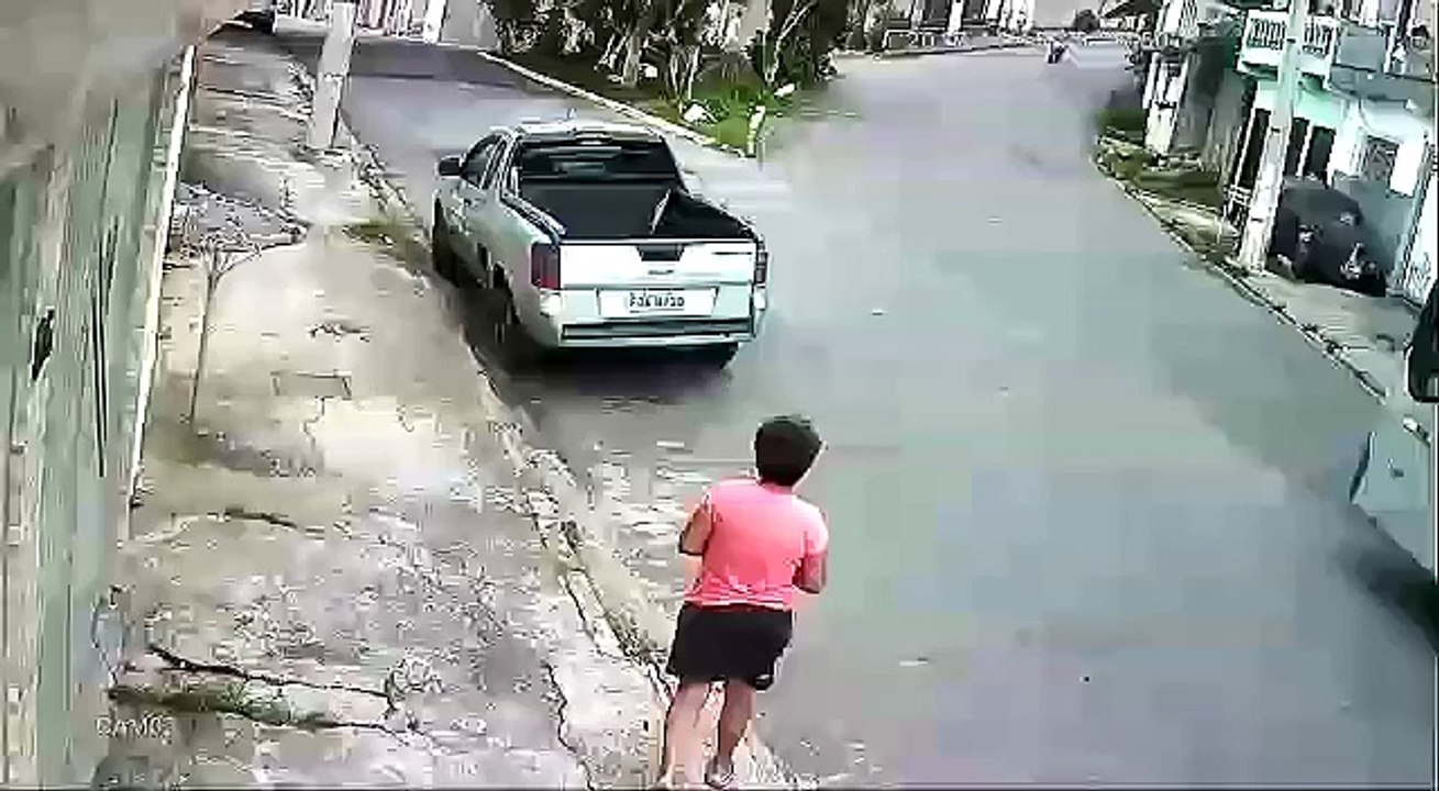 Motorcyclist crashes head on with car and is brutally flipped into his demise.