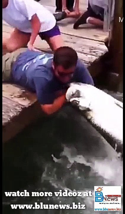 man catch fish with bear hands