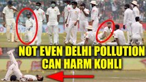India vs SL 3rd test 2nd day : Virat Kohli stretches on field as Lankans use mask for pollution