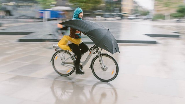 This umbrella will keep you dry while riding your bike