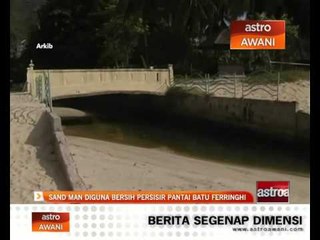 Sand Man diguna bersih pesisir pantai Batu Feringghi