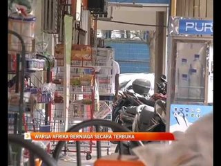 Warga Afrika berniaga secara terbuka
