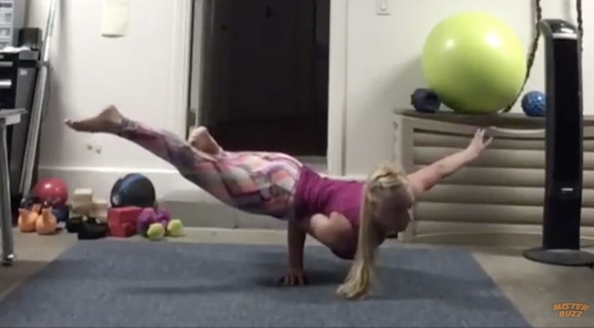 She stands upside down only on one hand!! Best Yoga move!