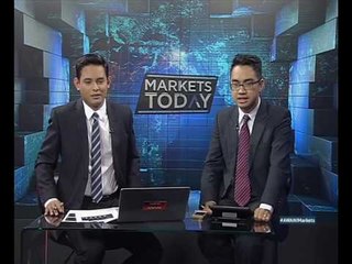 What did PETRONAS do to get profits up 12% when revenue is down considerably