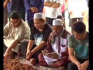 Johan Nawawi laid to rest