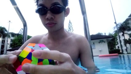 Man solves 12-sided Rubik’s cube underwater in inebriated breath
