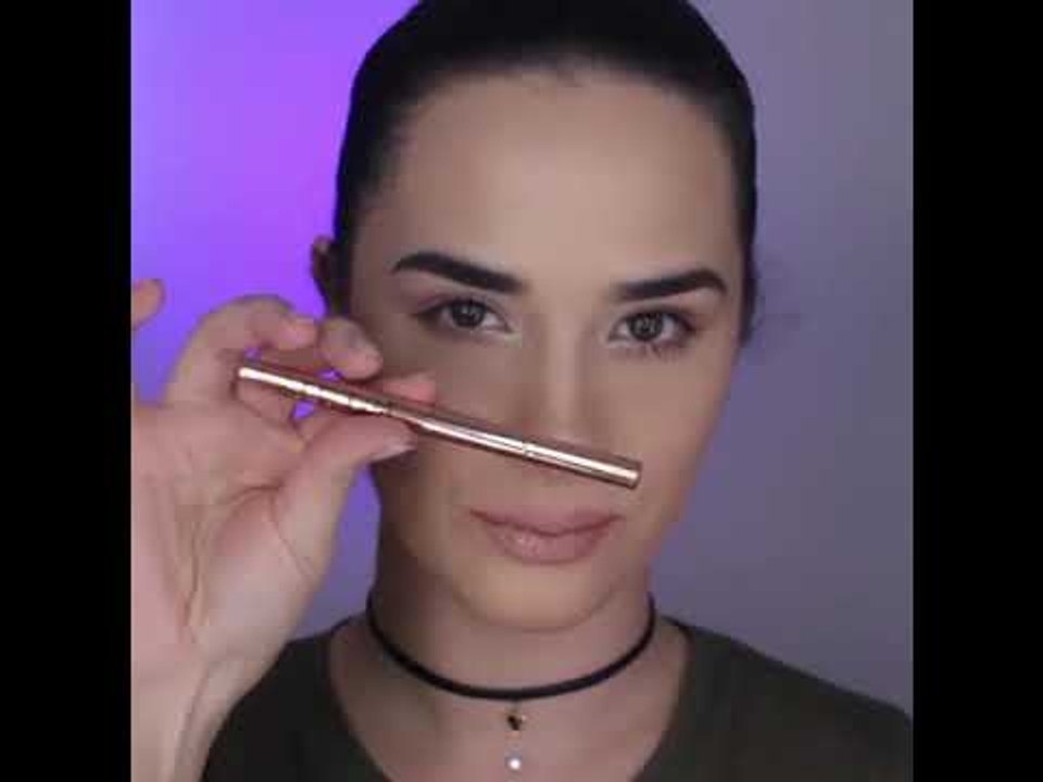 Women Demonstrates Cat Eyeliner Stencil