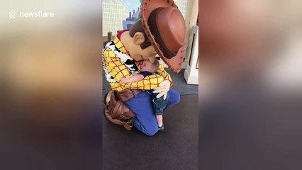 Boy, 2, meets Woody from 'Toy Story' for first time and just won’t let go