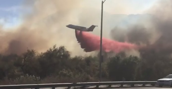 Fire Crews Work to Douse Wind-Fueled Lilac Fire