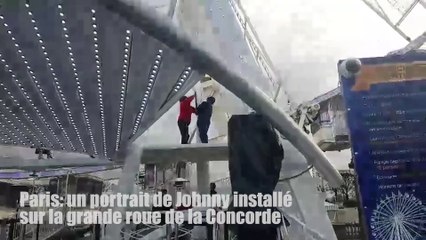 Un portrait de Johnny installé sur la grande roue de la Concorde à Paris