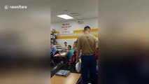 US marine surprises his little sister by showing up at her school