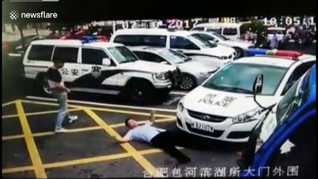 Bizarre moment man pretends to be hit by a police car