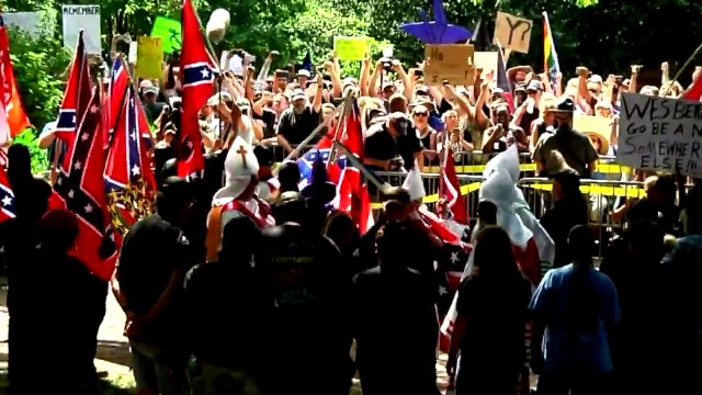 Priest Who Used to be in KKK Apologizes to Couple Targeted in Cross Burning