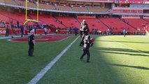 Raiders players play a game of catch with young fans