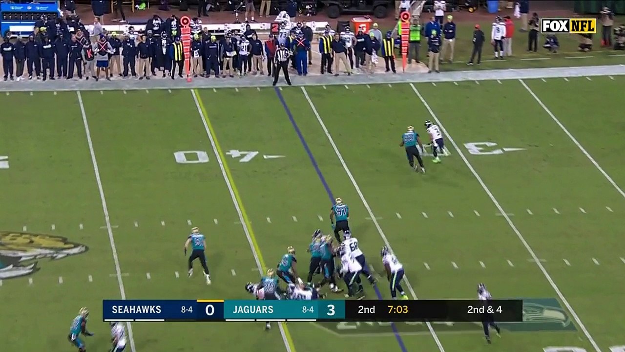 Seattle Seahawks quarterback Russell Wilson sprints around Jacksonville Jaguars defensive end Calais Campbell on 19-yard scamper