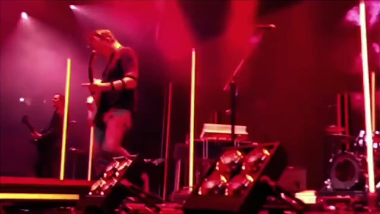 Queens of the Stone Age's Josh Homme Kicks Photographer