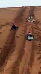 Arab Man Desert Sliding as Funny Style in Dubai United Arab Emirates.