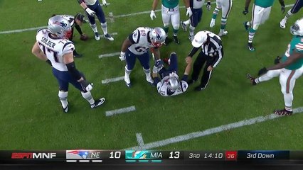Referee helps Tom Brady to his feet following sack