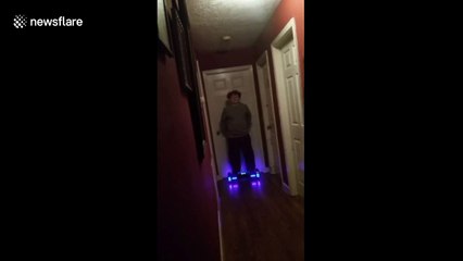 Boy on hoverboard crashes into Christmas tree