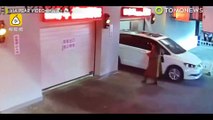CCTV footage shows phone-addicted woman walking into parking garage and getting trapped - TomoNews