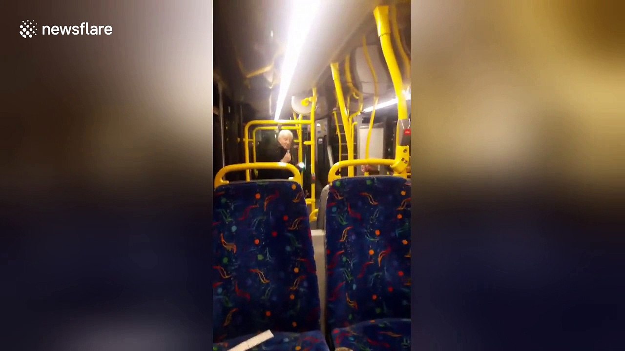 Bus passengers cheer up with elderly man impromptu performance
