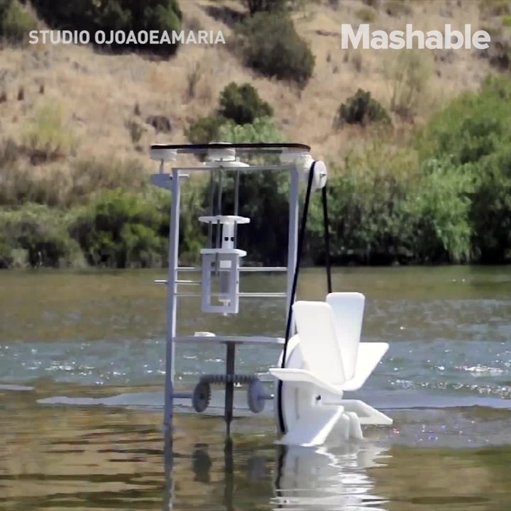 A 3D printer powered by a watermill prints ceramic pottery