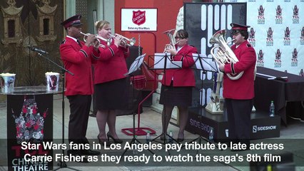 Star Wars fans honor Carrie Fisher as new film premieres