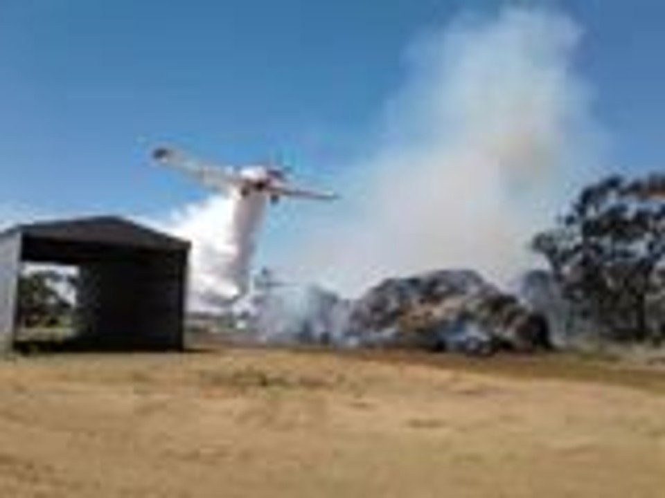 Water Bombing Plane Douses Haystack Fire
