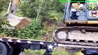 Excavator Resque Moving Between Two Self Loader Truck